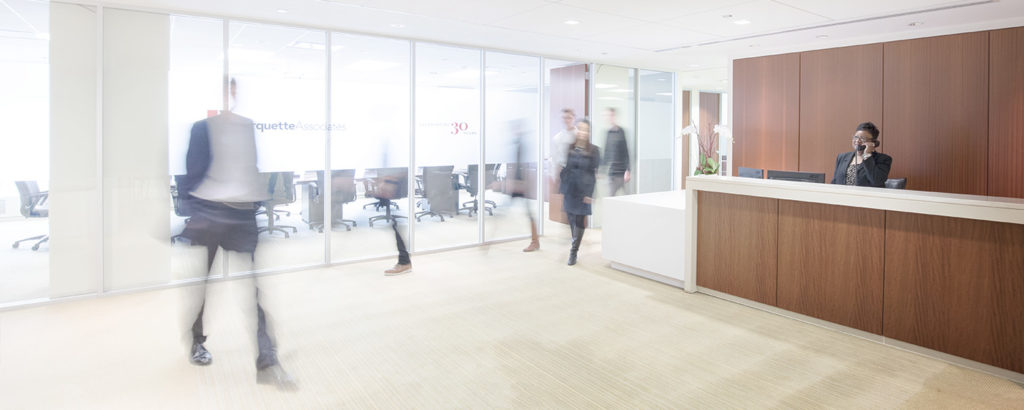 People moving through Marquette Associates' offices by Blue Flame Thinking.