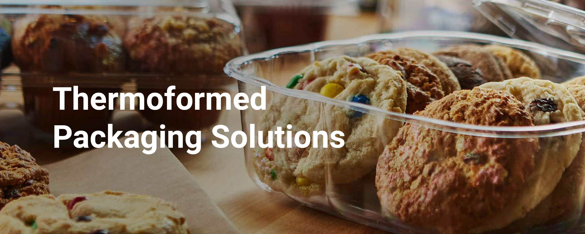 Cookies in a container with words Thermoformed Packaging Solutions