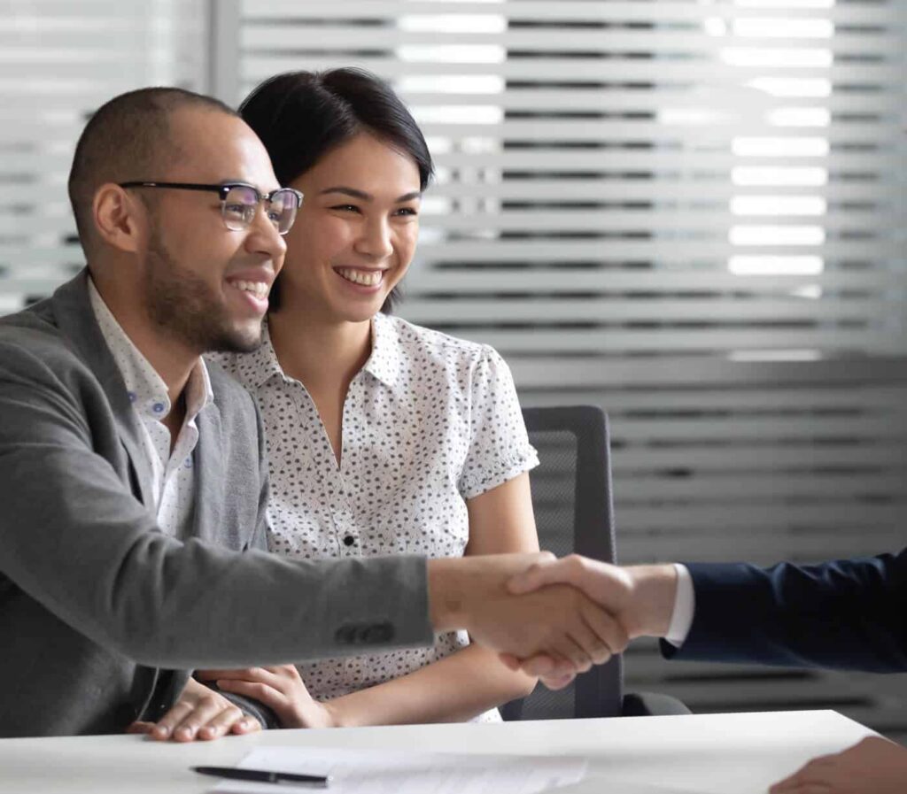 Image of two people meeting with a financial advisor