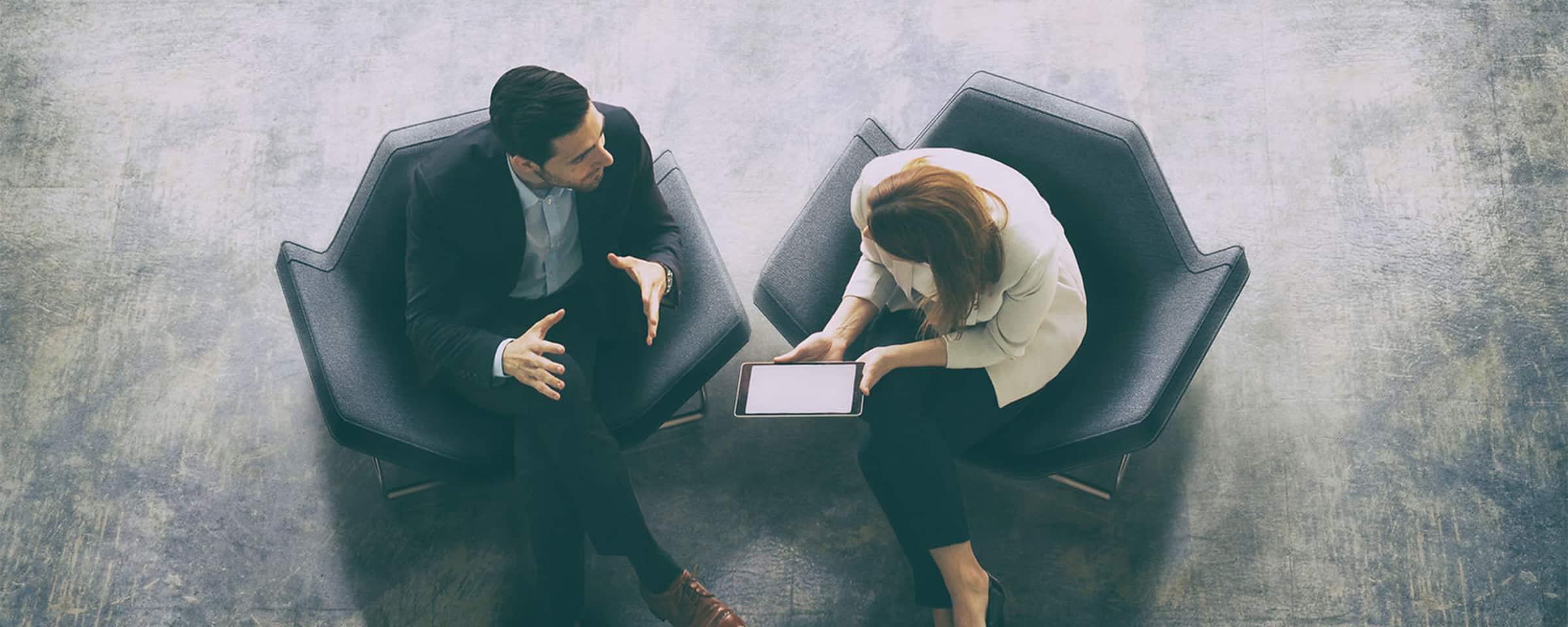 Overhead view of two people sitting in chairs